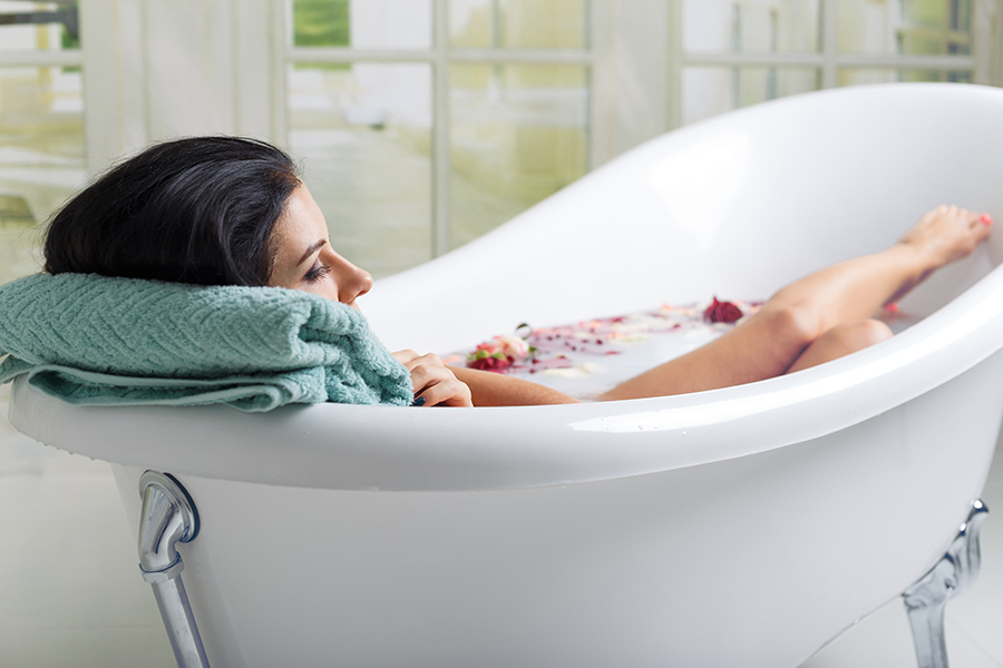 woman relaxes in a luxurious bath